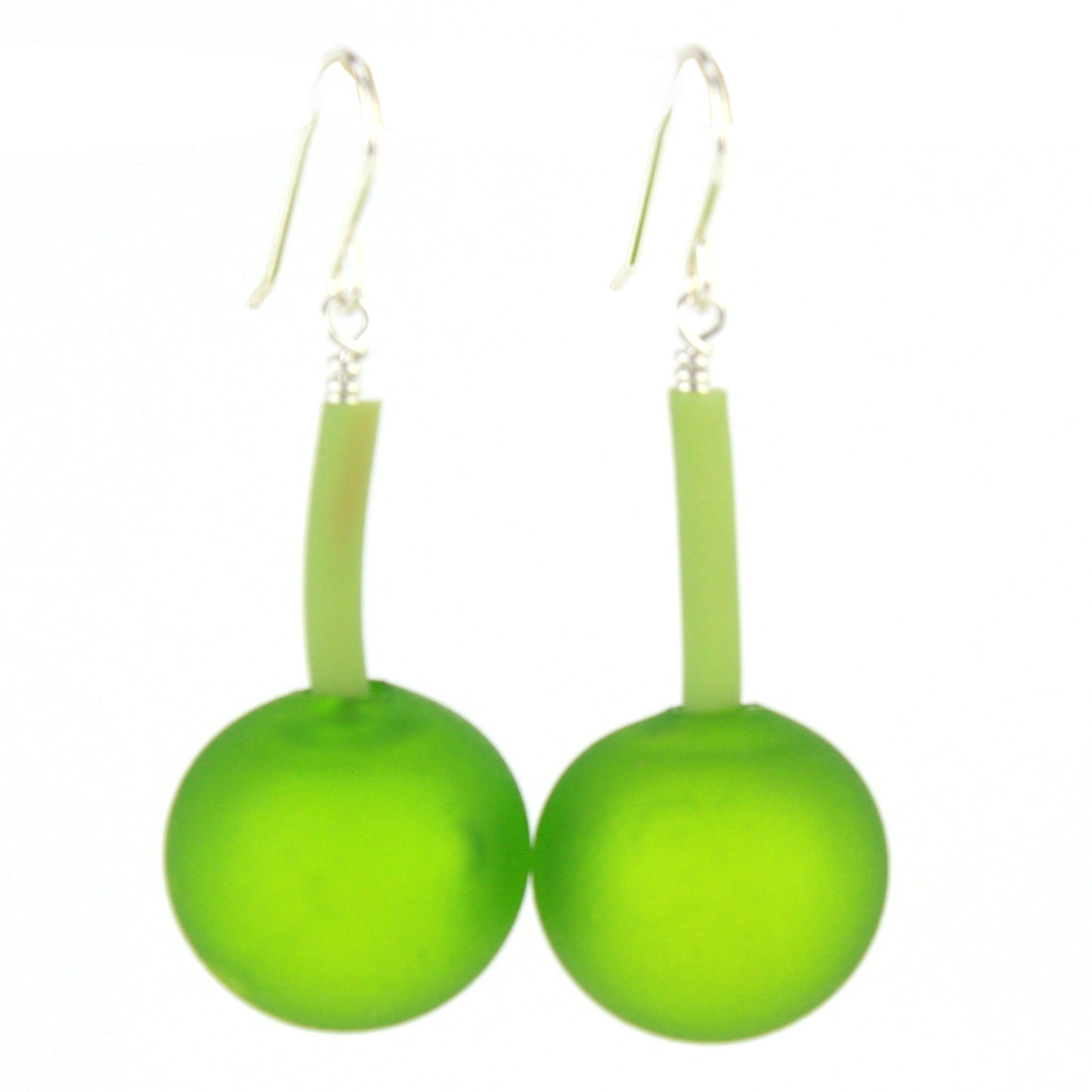 The Aura Earrings in Spring Green, featuring handcrafted frosted green glass beads suspended from flexible tubing with sterling silver hooks, designed for effortless elegance.