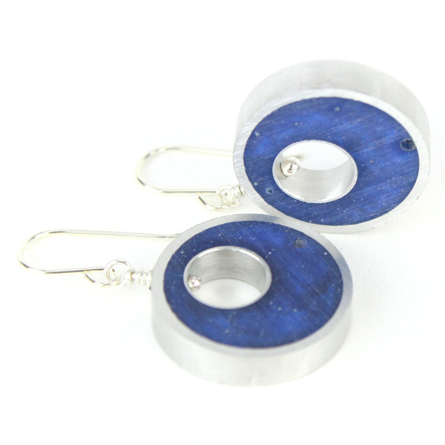 Dark blue Spotlight Earrings made of eco-resin and salvaged aluminum with sterling silver ear wires for lightweight, sustainable elegance.