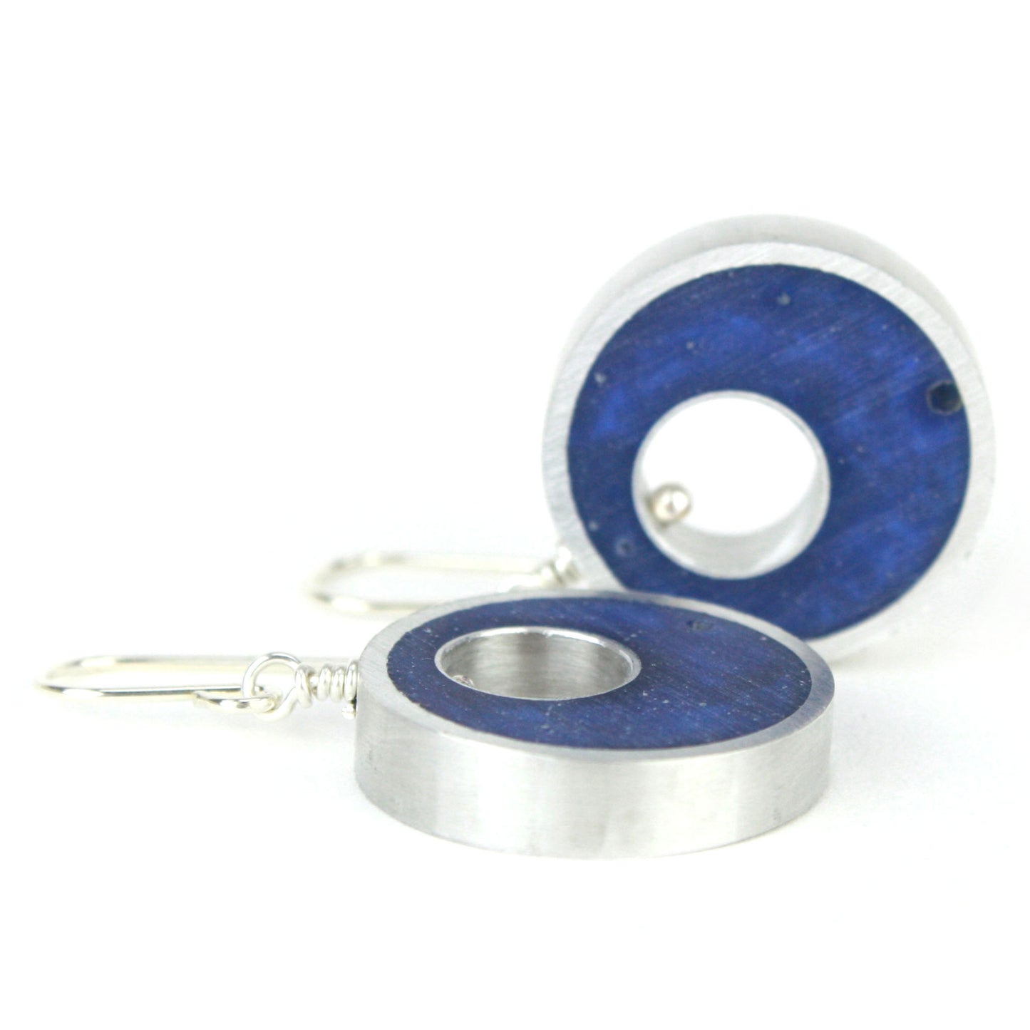 Dark blue Spotlight Earrings made of eco-resin and salvaged aluminum with sterling silver ear wires for lightweight, sustainable elegance.