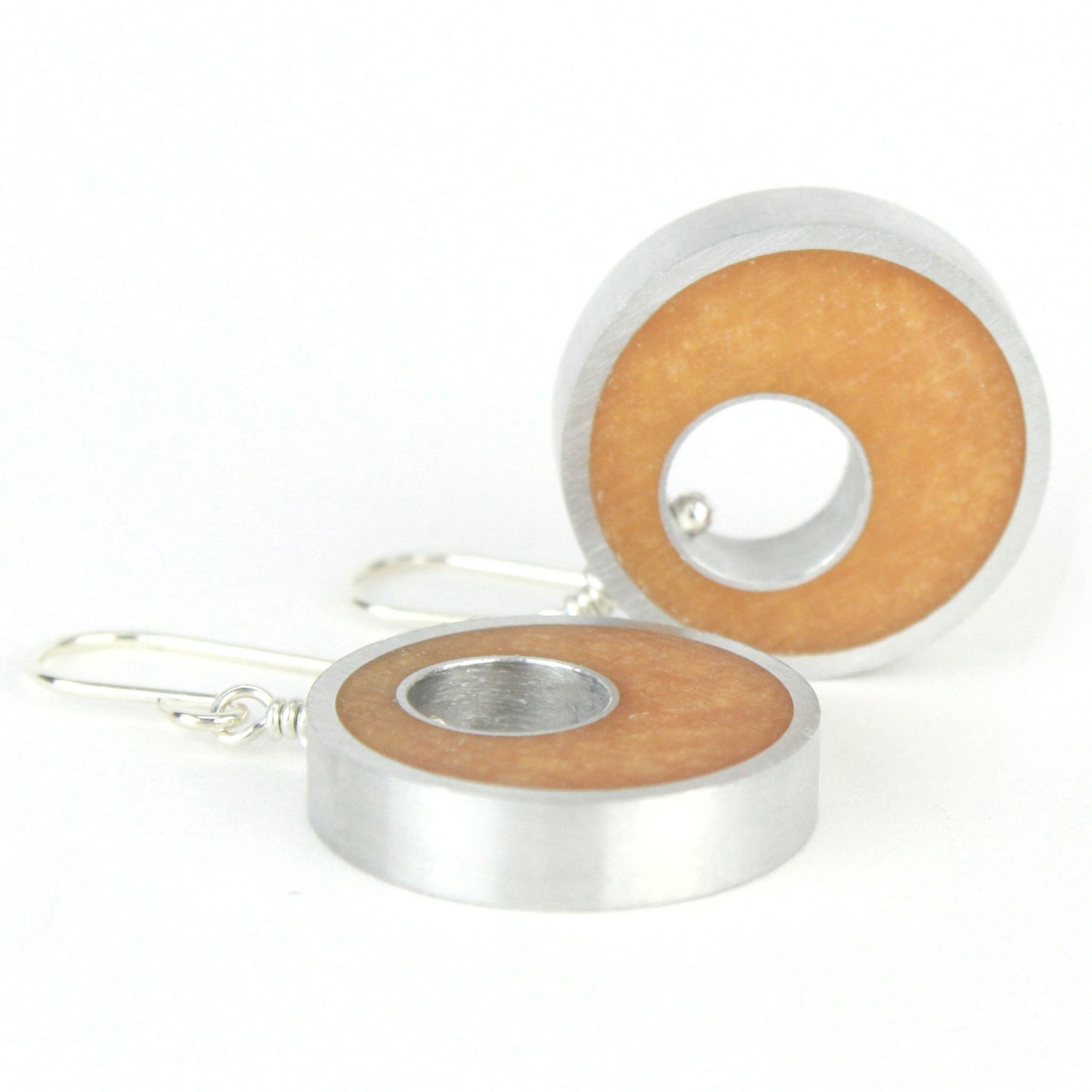 Gold Spotlight Earrings made of eco-resin and salvaged aluminum with sterling silver ear wires, offering lightweight and sustainable elegance.