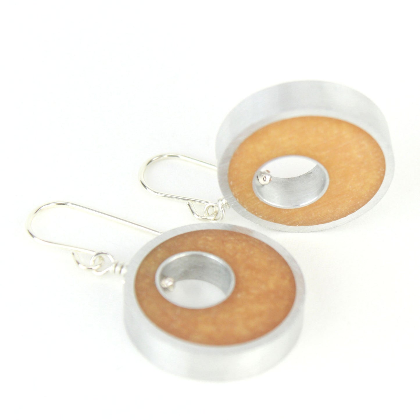 Gold Spotlight Earrings made of eco-resin and salvaged aluminum with sterling silver ear wires, offering lightweight and sustainable elegance.