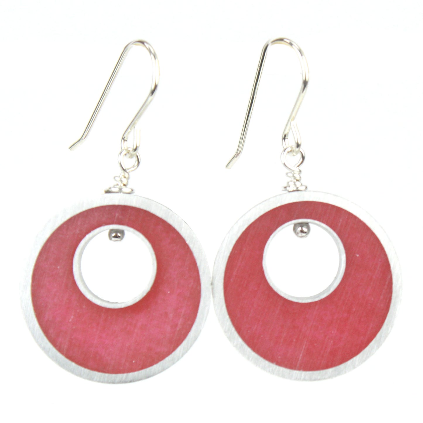 Bright pink Spotlight Earrings made of eco-resin and salvaged aluminum with sterling silver ear wires, offering lightweight and sustainable beauty.