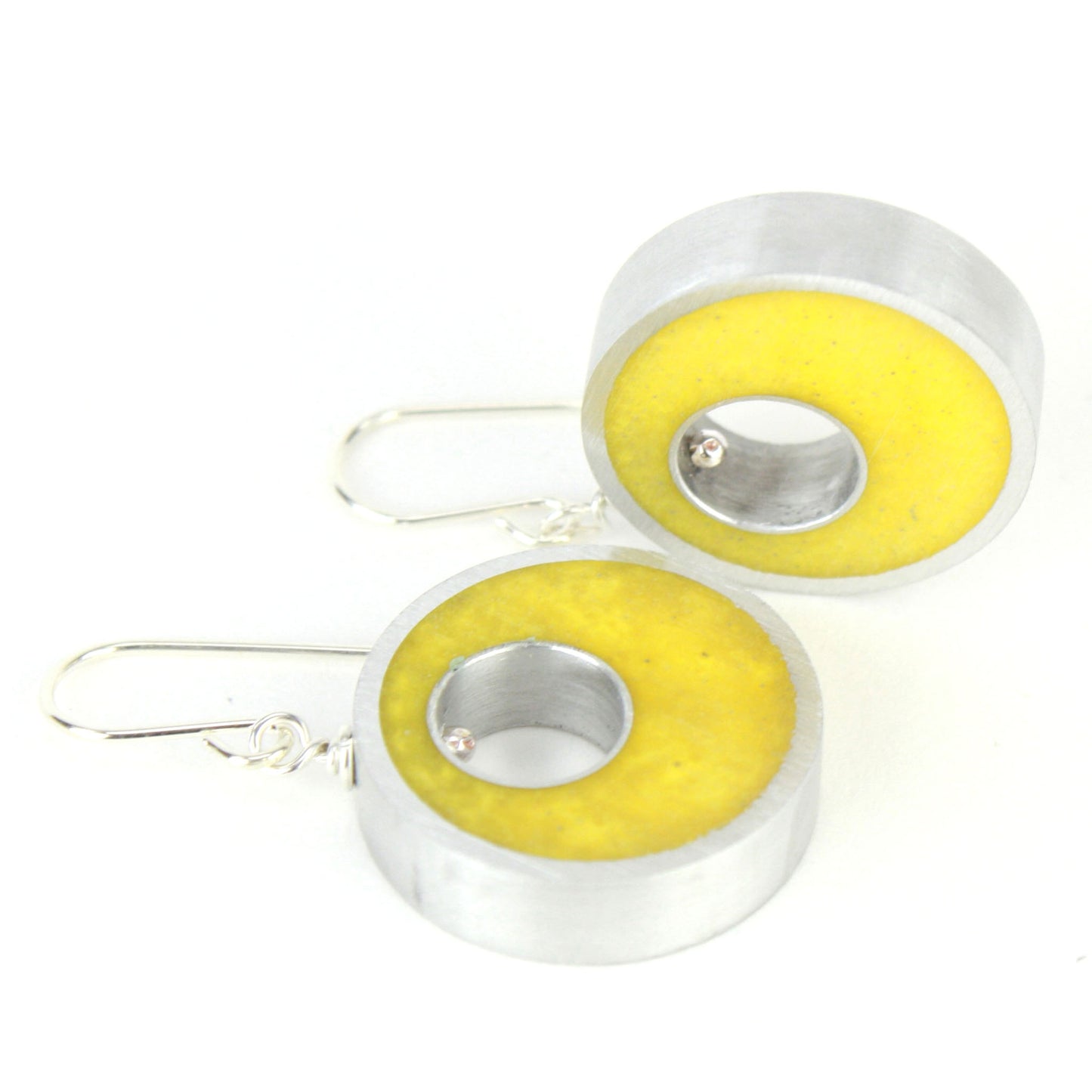 Yellow Spotlight Earrings made of eco-resin and salvaged aluminum with sterling silver ear wires, offering lightweight and sustainable brilliance.