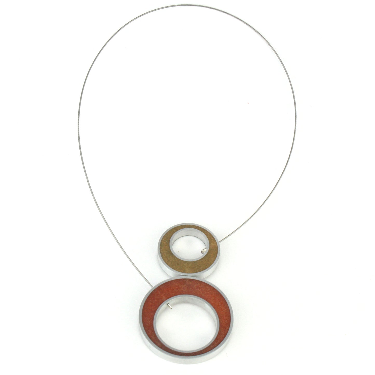 Reversible Duet Necklace featuring two color combinations, crafted from eco-resin and salvaged aluminum with a lightweight magnetic closure. Shown in gold and copper combination.