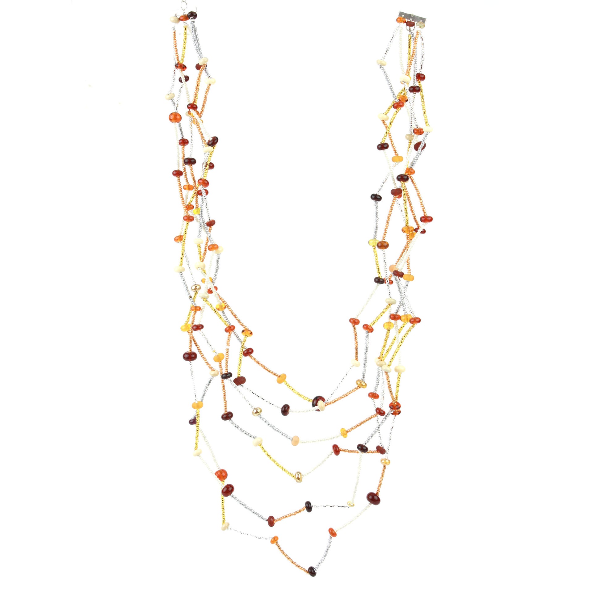 The Fiesta Necklace in amber, ivory and gold. Handcrafted six-strand necklace in amber, ivory, and gold glass beads with handmade lampwork accents and a zig-zag drape.