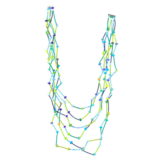 The fiesta Necklace in blues and greens Lightweight zig-zag necklace with blue and green glass beads, handmade lampwork accents, and sterling silver clasp.