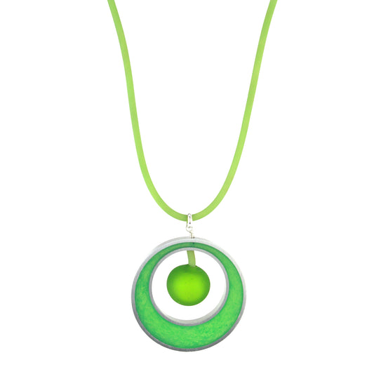 The Glory Necklace in Spring Green, featuring a handcrafted pendant made from eco-resin, salvaged aluminum, and frosted blown glass, suspended on a fully adjustable silicone cord.