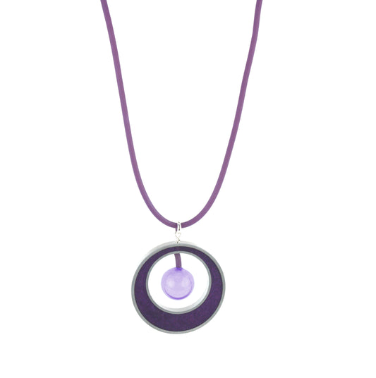 The Glory Necklace in Color-Changing Purple, featuring a handcrafted pendant made from eco-resin, salvaged aluminum, and a blown glass bead that shifts from purple to blue under fluorescent light.