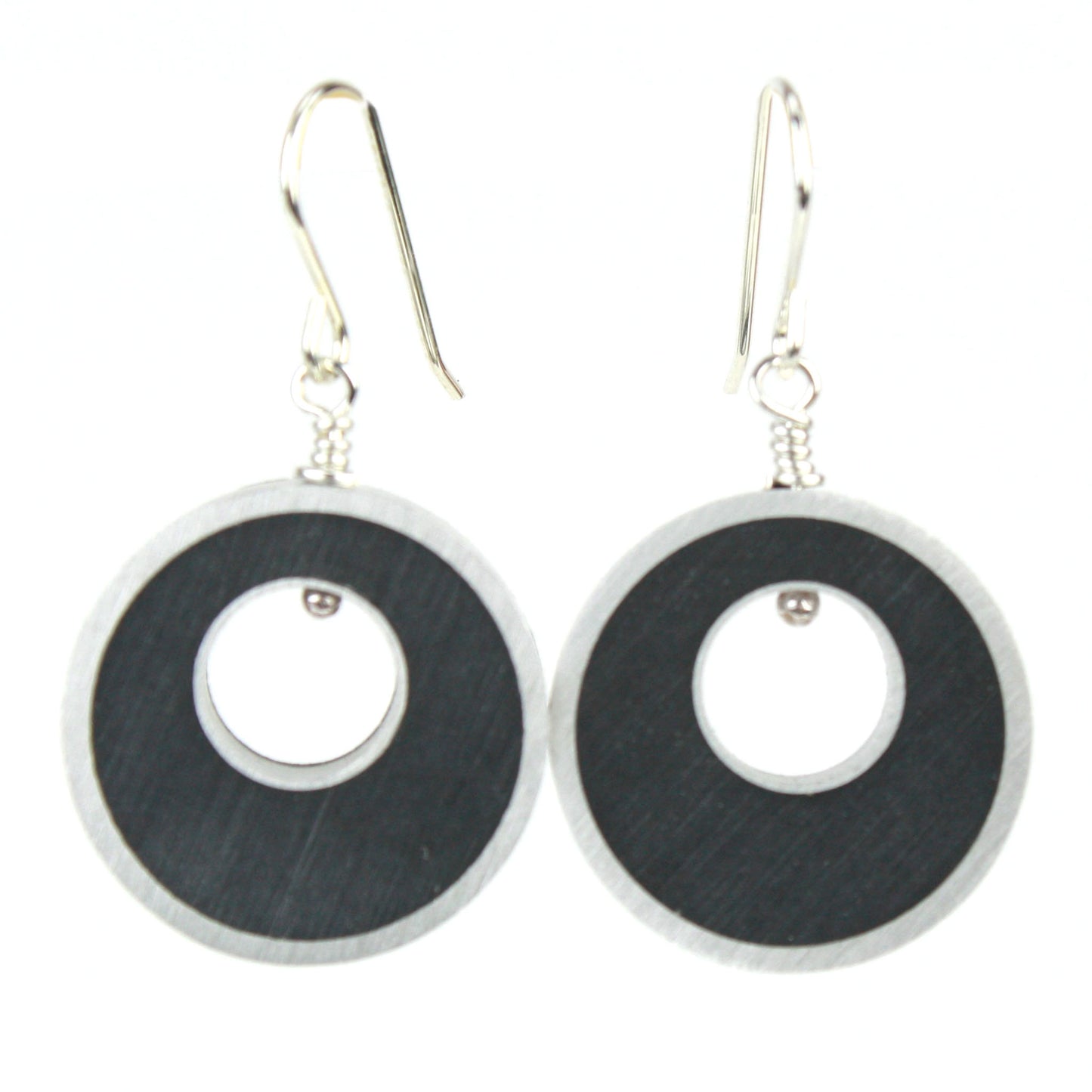 Black Spotlight Earrings made of eco-resin and salvaged aluminum with lightweight construction and sterling silver ear wires.