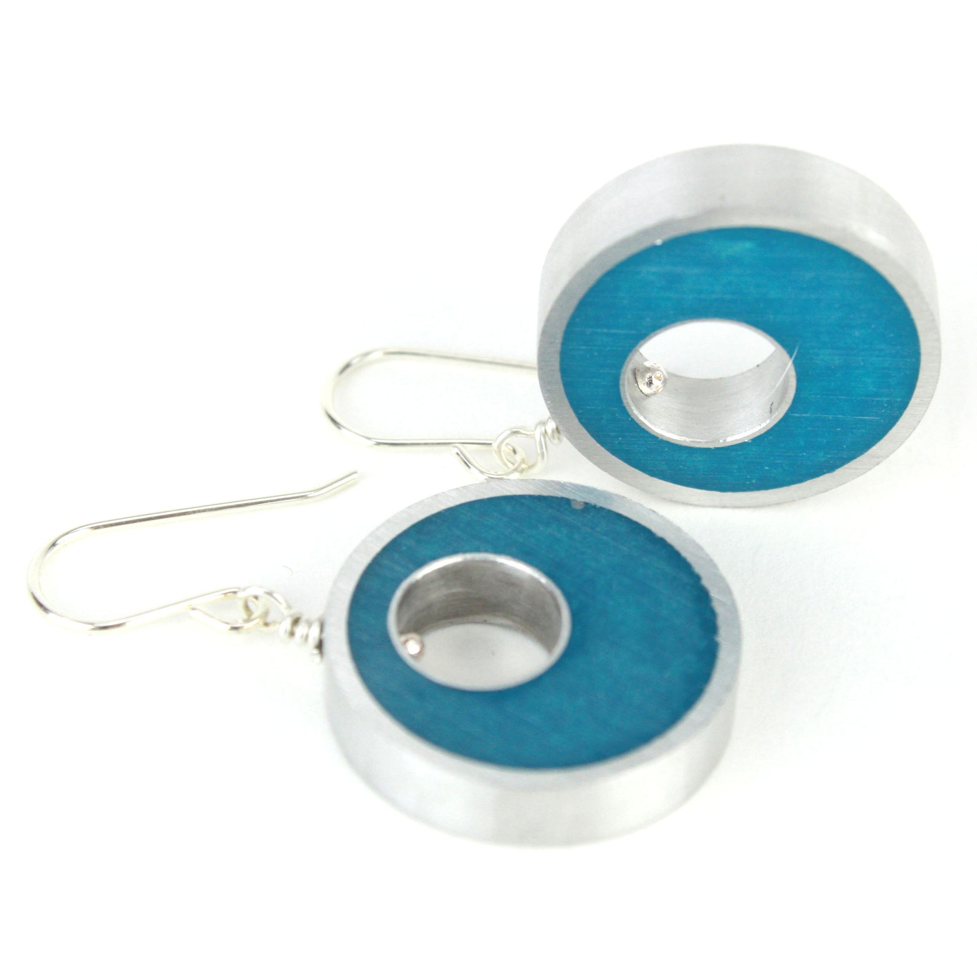 Blue-green Spotlight Earrings made of eco-resin and salvaged aluminum, featuring lightweight construction and sterling silver ear wires.