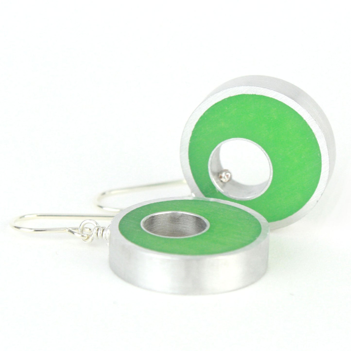 Green Spotlight Earrings made of eco-resin and salvaged aluminum with sterling silver ear wires, offering lightweight and sustainable style.