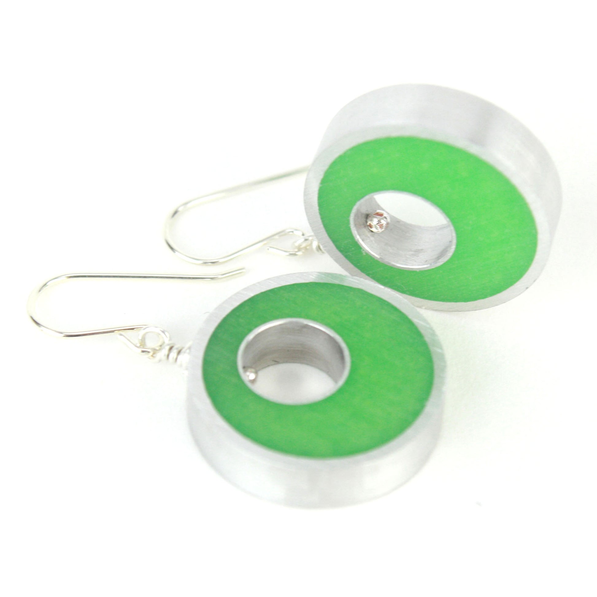 Green Spotlight Earrings made of eco-resin and salvaged aluminum with sterling silver ear wires, offering lightweight and sustainable style.