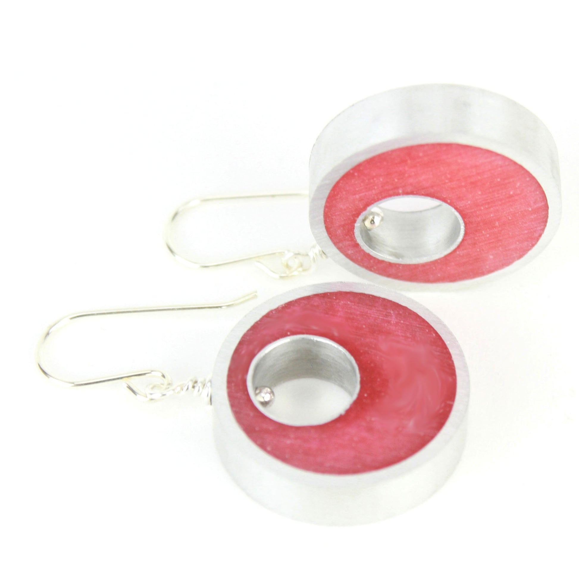 Red Spotlight Earrings made of eco-resin and salvaged aluminum with sterling silver ear wires, offering lightweight and sustainable elegance.