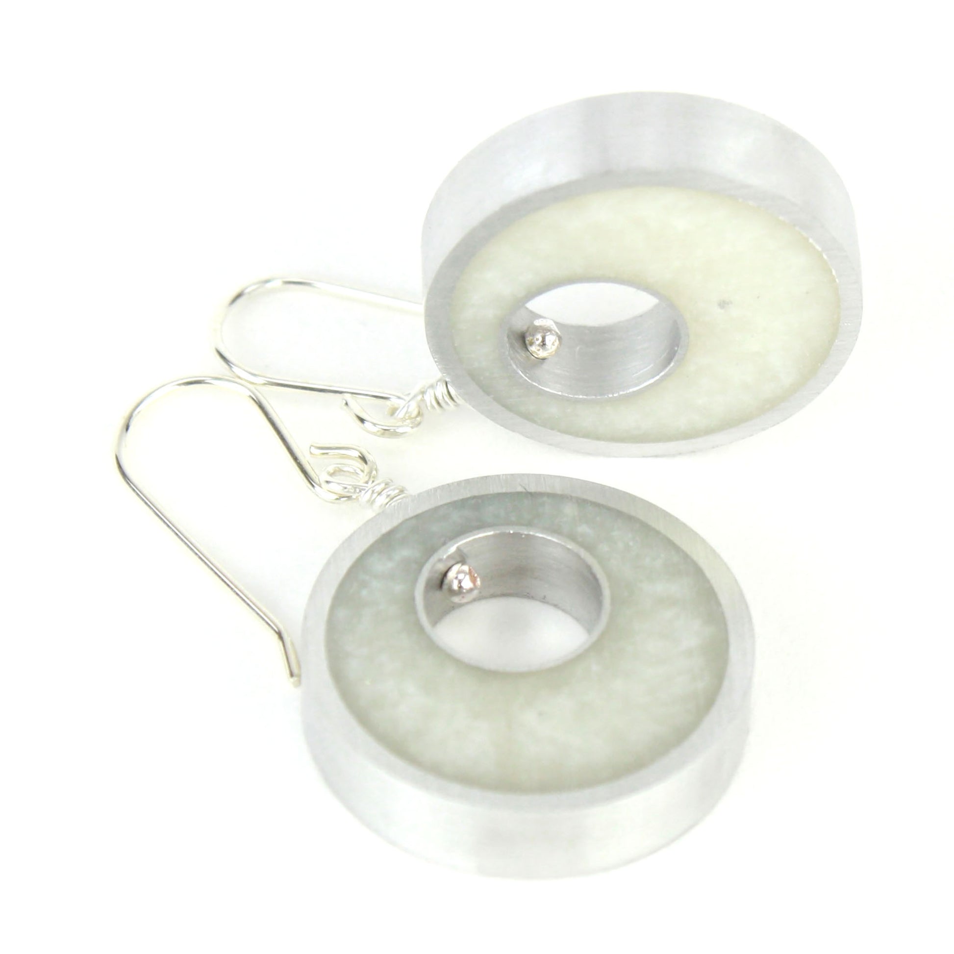 White Spotlight Earrings made of eco-resin and salvaged aluminum with sterling silver ear wires, offering lightweight and sustainable sophistication.