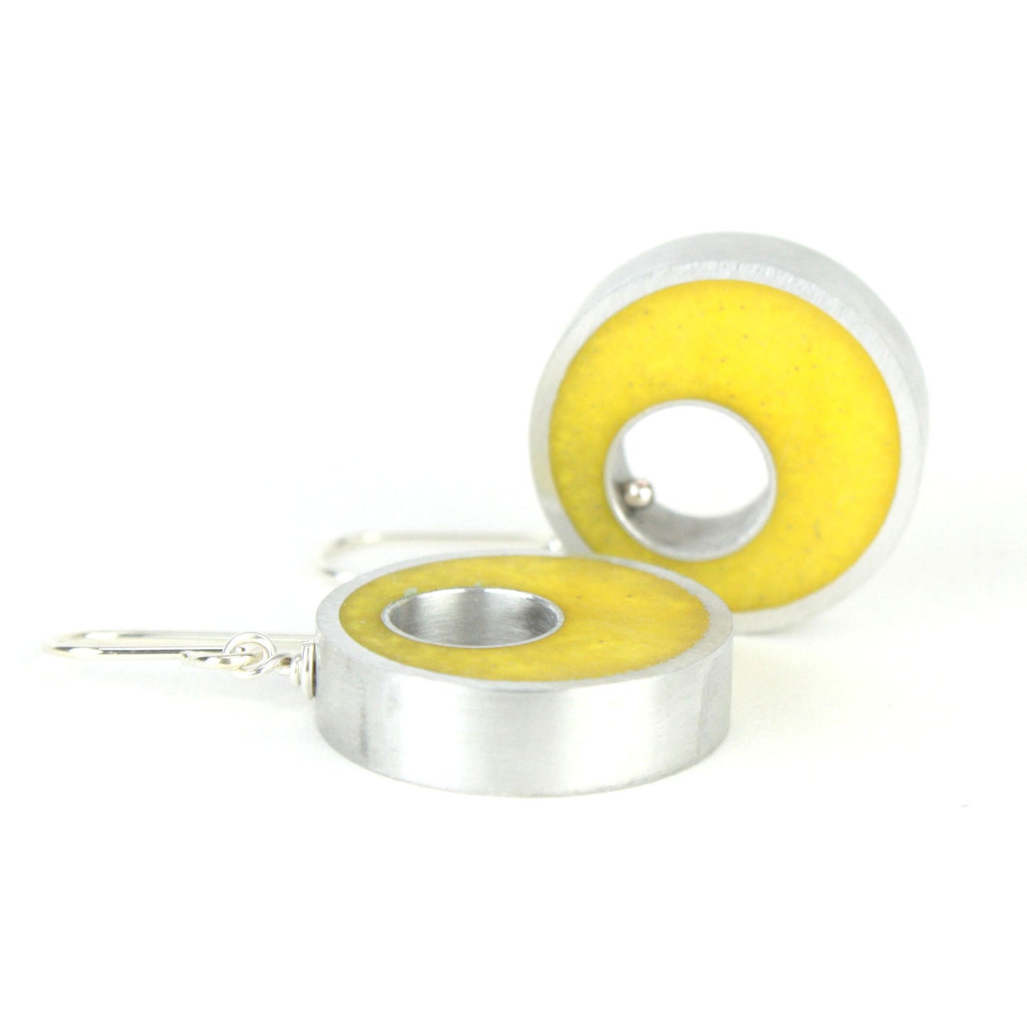 Yellow Spotlight Earrings made of eco-resin and salvaged aluminum with sterling silver ear wires, offering lightweight and sustainable brilliance.

