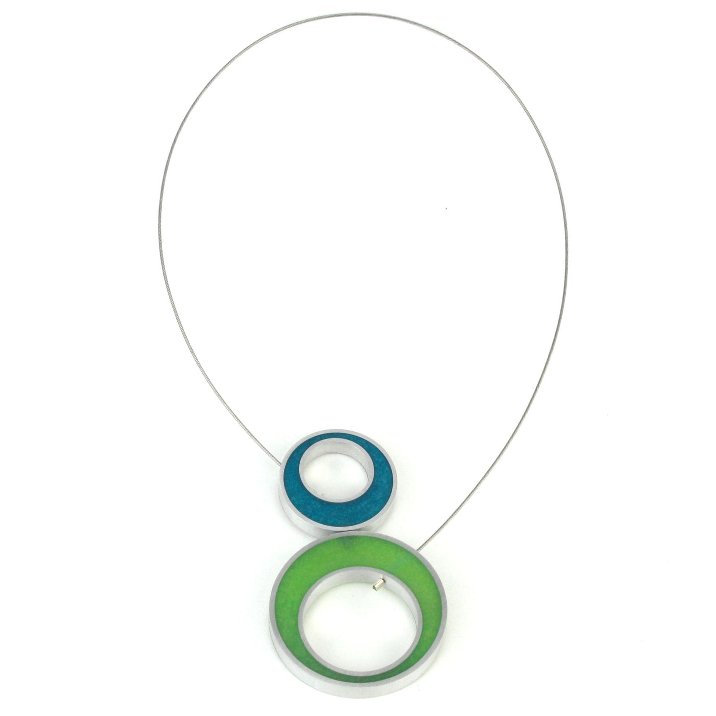 A reversible Duet Necklace featuring two color combinations, crafted from eco-resin and salvaged aluminum with a magnetic front closure. Blue and green on this side.