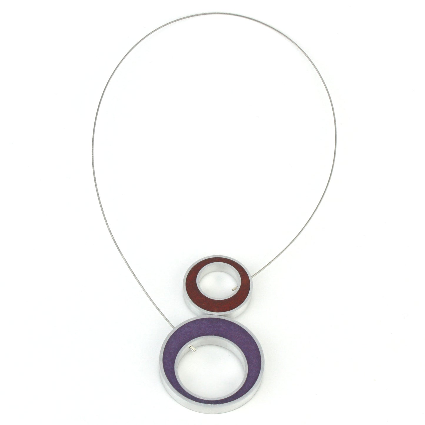 Reversible Duet Necklace made of eco-resin and salvaged aluminum, featuring two distinct color combinations and a lightweight design with a magnetic closure. Shown with the ruby red and purple combination.