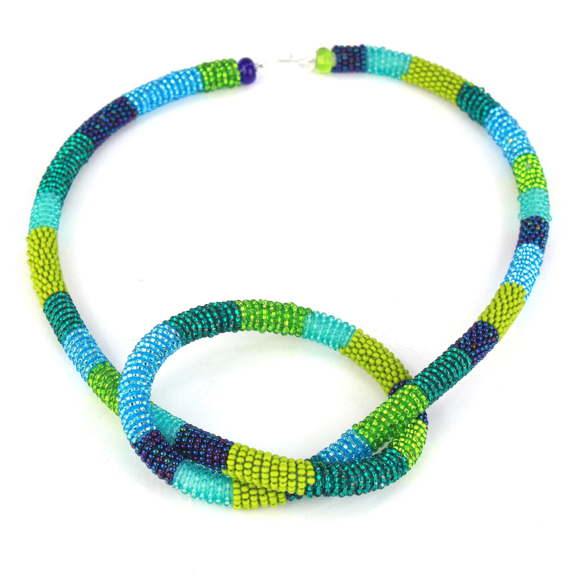 Confetti Knot Necklace in blue and green glass beads on a soft silicone core with a sterling silver hook-and-loop closure.